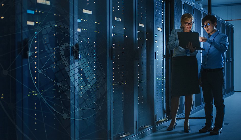 Two award-winning individuals standing in a server room located in Hong Kong.